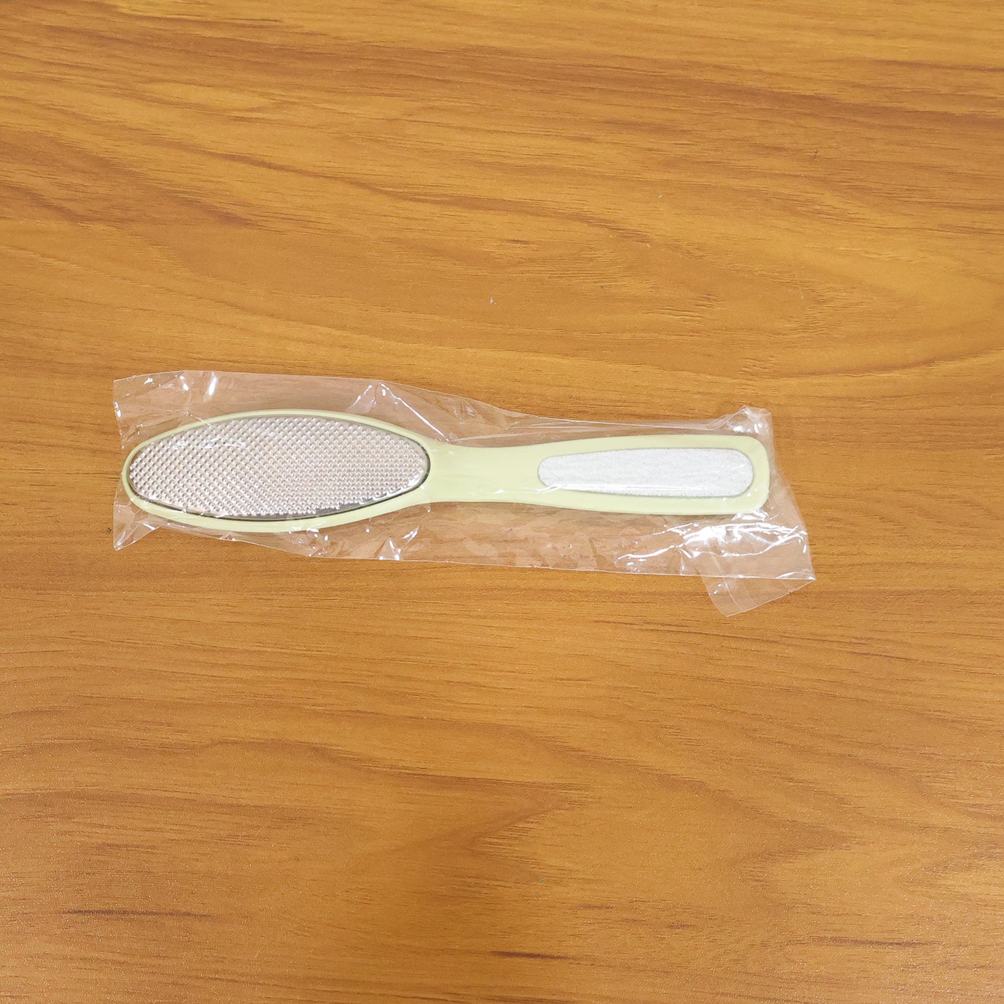 Wukusy dual-sided foot care pedicure file showing textured surfaces for smoothing and exfoliating feet.