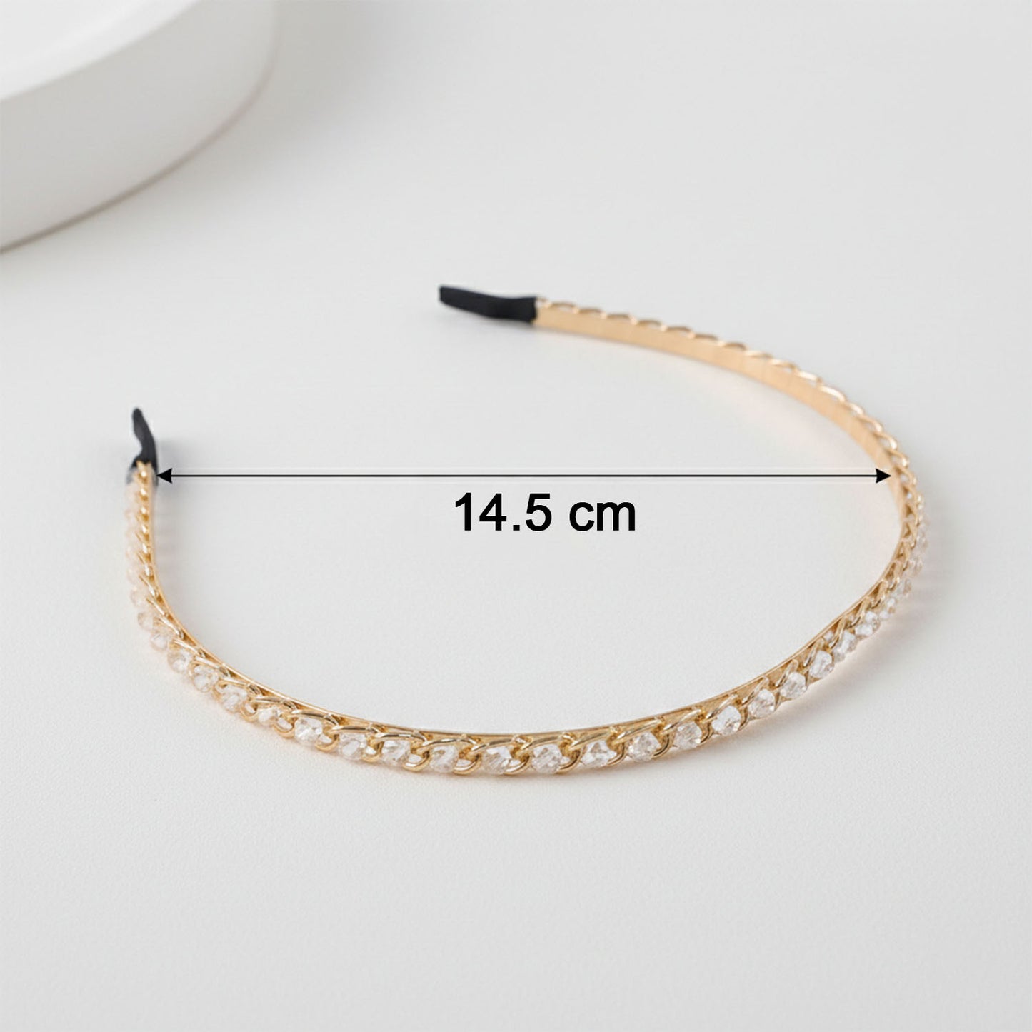 Elegant crystal-studded metal hair band by Wukusy, featuring sparkling embellishments and a sleek design for stylish hair accessory.
