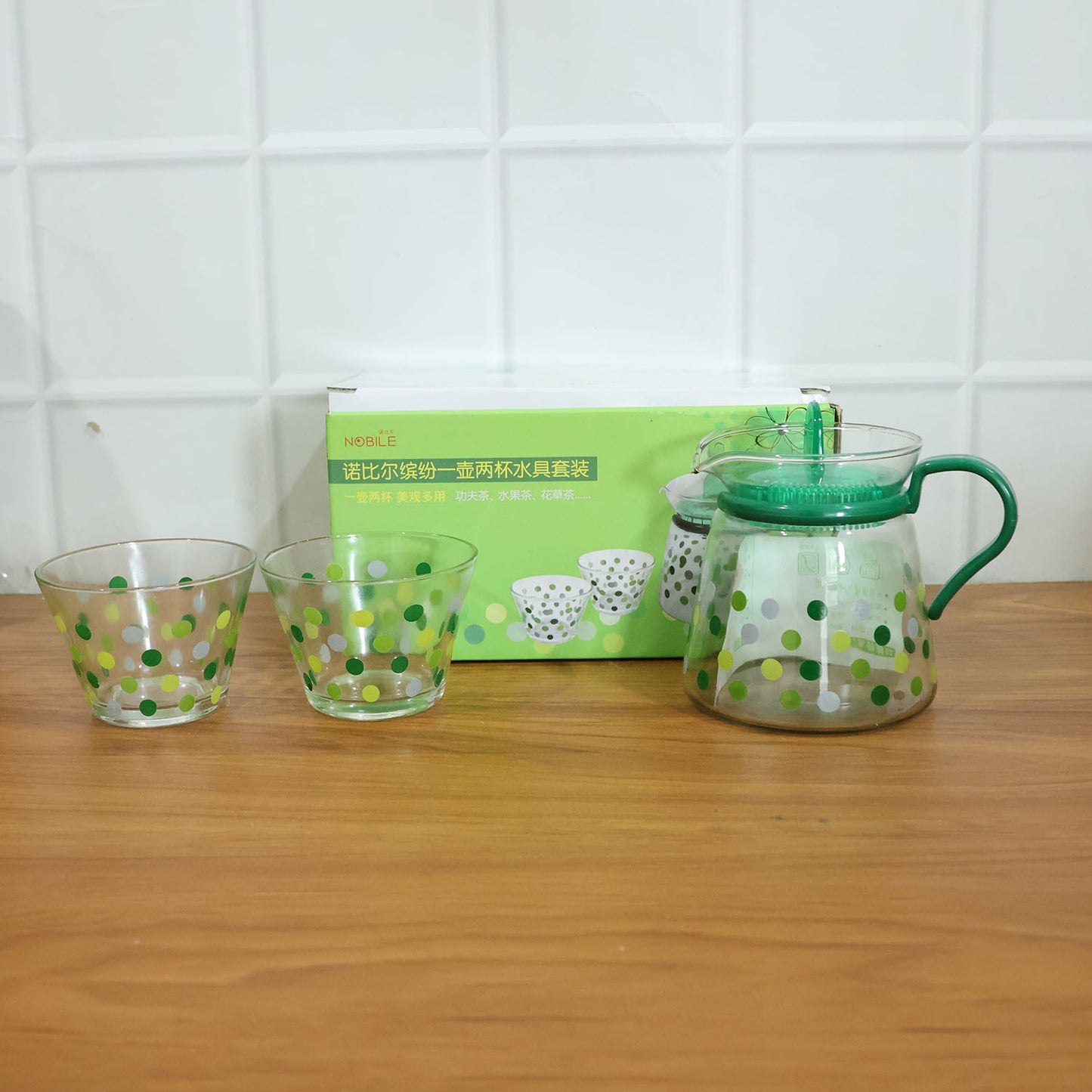 Elegant glass tea pot with matching cups set by Wukusy, featuring a clear, stylish design for serving tea.