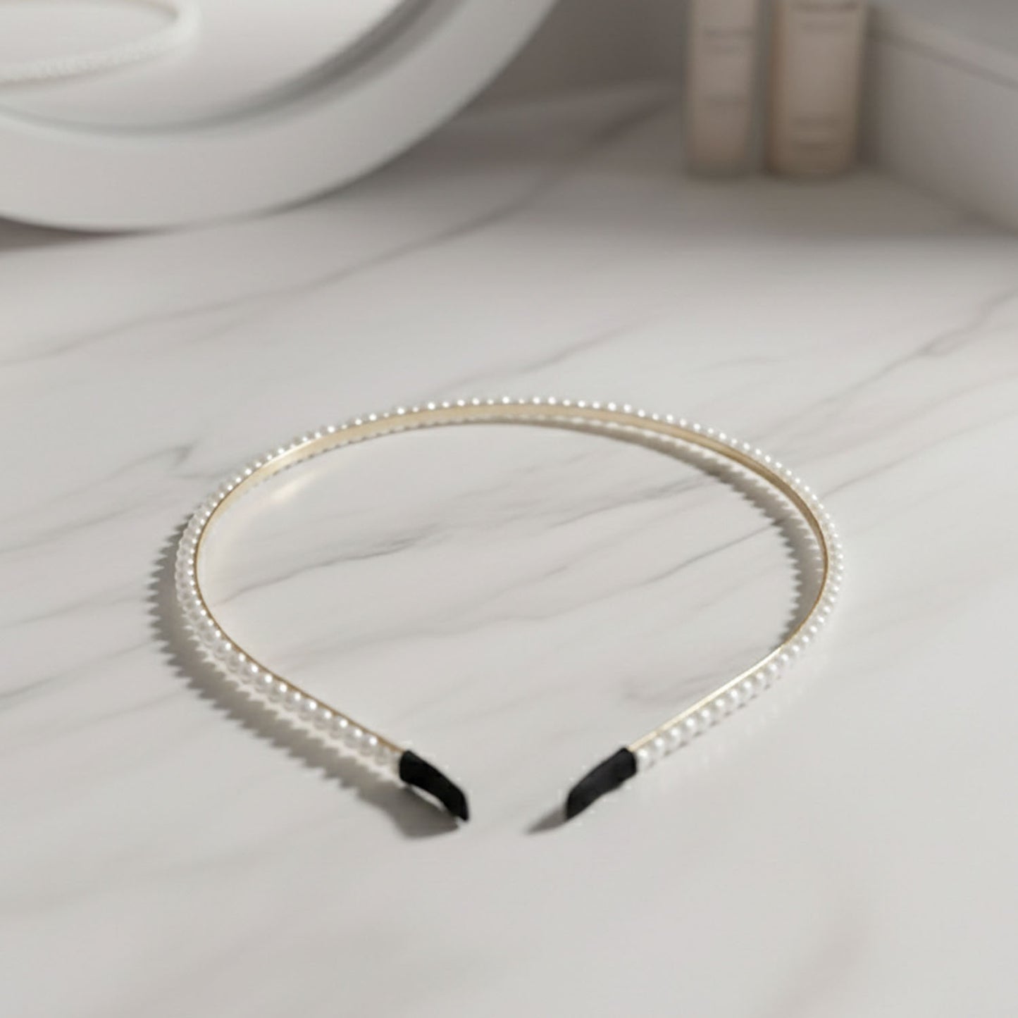 Elegant pearl beaded slim golden metal hair band by Wukusy, featuring delicate pearl accents and a sleek design for stylish hair accessories.