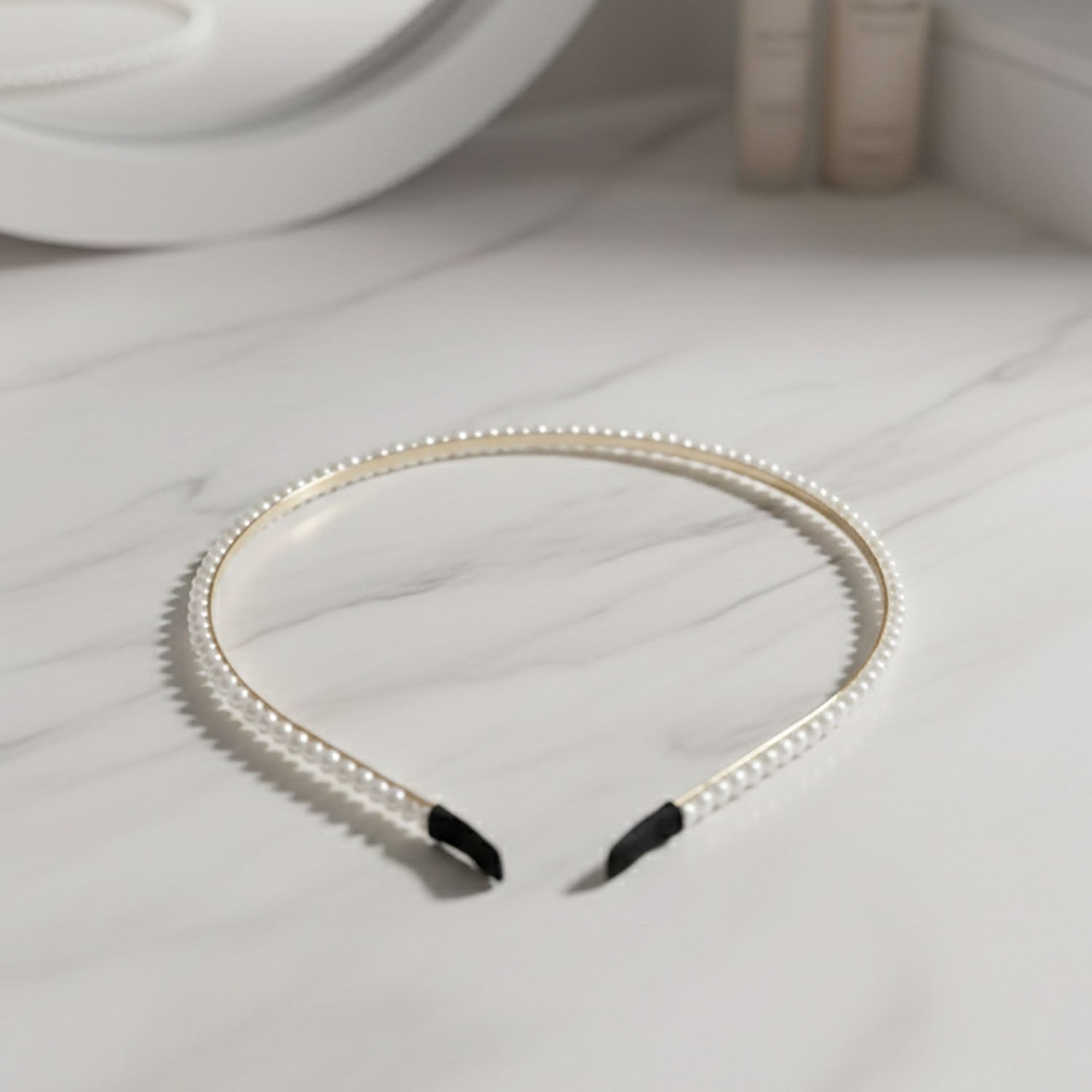 Elegant pearl beaded slim golden metal hair band by Wukusy, featuring delicate pearl accents and a sleek design for stylish hair accessories.
