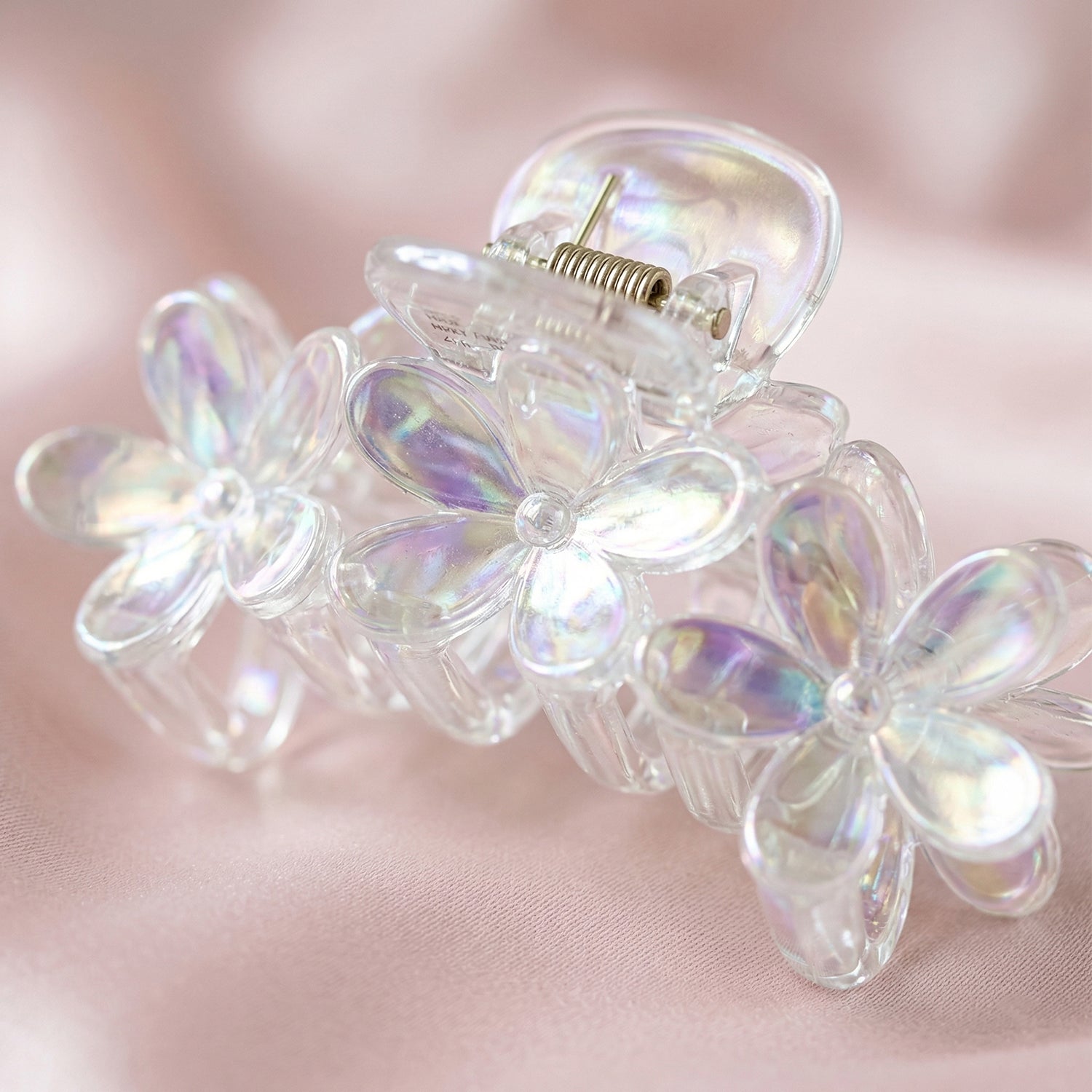 Elegant transparent floral hair claw clip by Wukusy, showcasing a delicate floral design and sturdy clasp for stylish hair styling