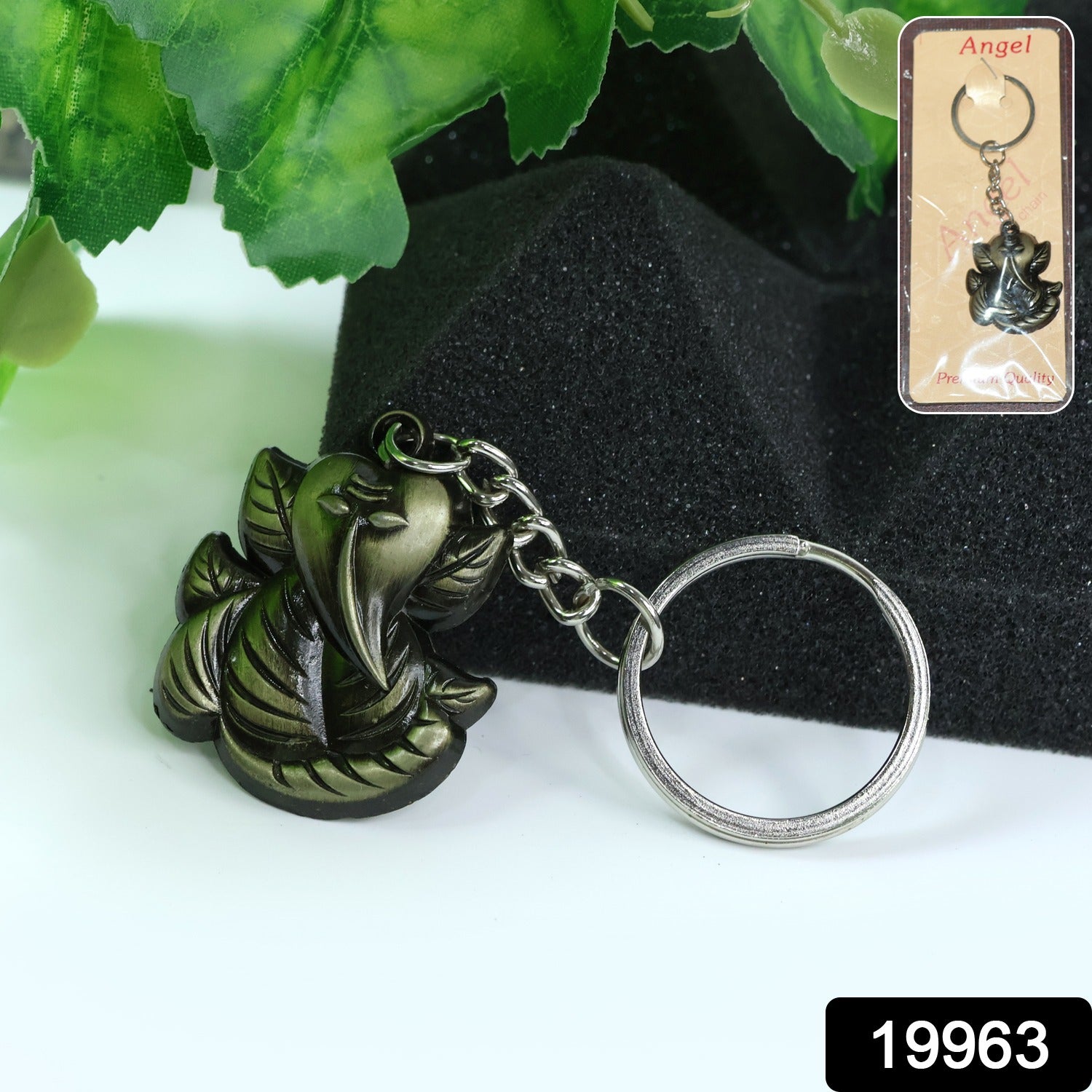 Antique black metal Ganesh face keychain by Wukusy, featuring detailed Hindu deity design on a compact key accessory.