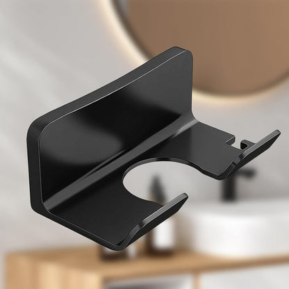 Wall-mounted Wukusy plastic hair dryer holder and organizer rack for bathroom or bedroom storage of hair tools.