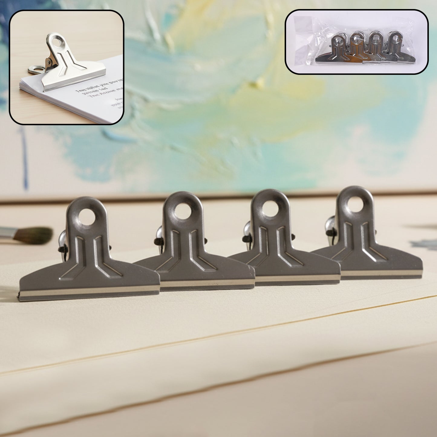 Set of four heavy-duty metal paper clamp clips by Wukusy, durable office clips for securing papers and documents.