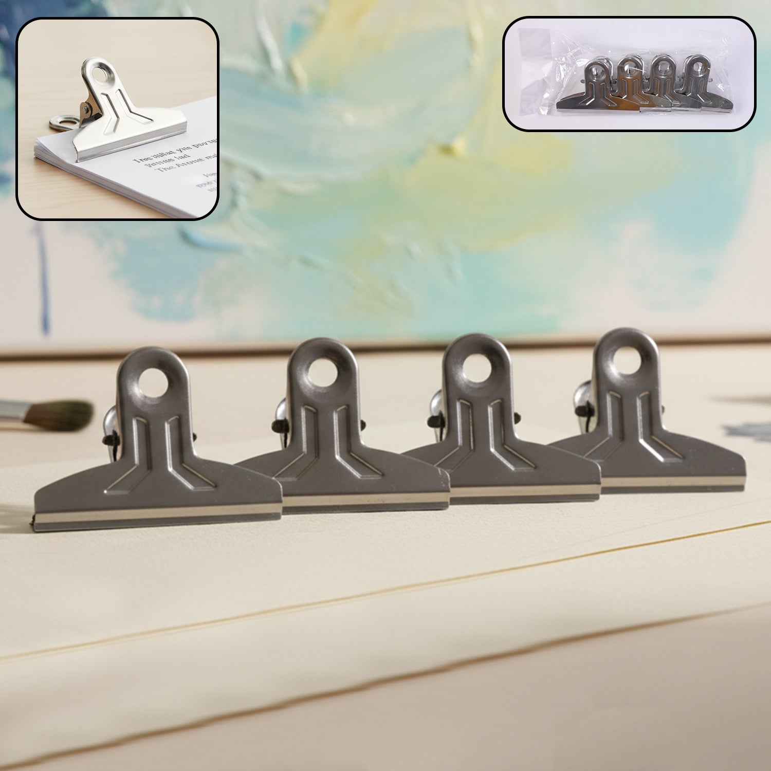 Set of four heavy-duty metal paper clamp clips by Wukusy, durable office clips for securing papers and documents.