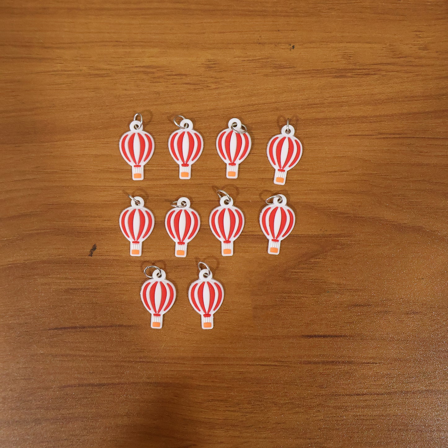 Wukusy hot air balloon bag charm keychain set with 10 colorful balloon designs on keychains for bags and accessories.