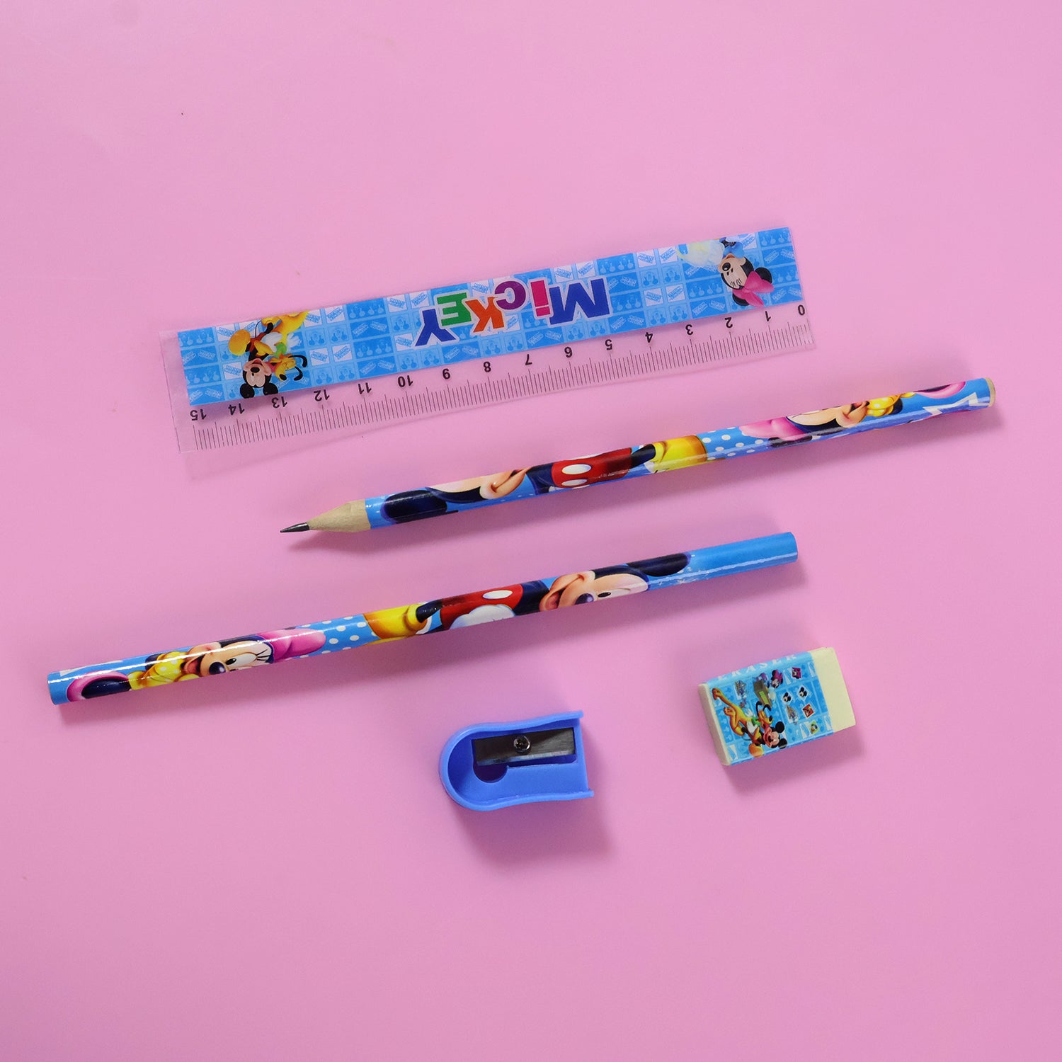 Kids 5-in-1 stationery kit by Wukusy featuring colorful pens, pencils, erasers, and a cartoon-style carry bag.