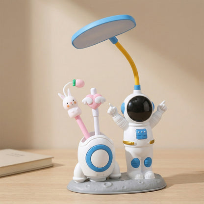 Kids astronaut LED study table lamp by Wukusy with built-in pencil sharpener, featuring a playful astronaut design.