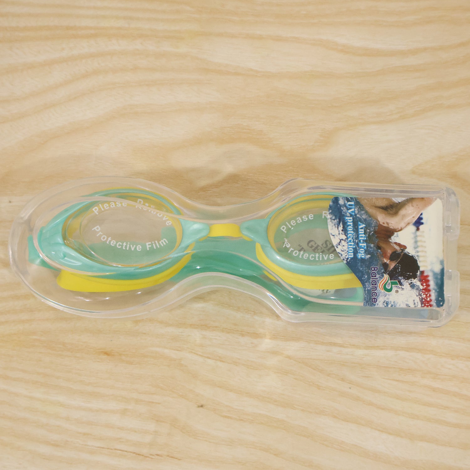 Kids dual-color swimming goggles by Wukusy with clear vision lenses and a comfortable fit for young swimmers.