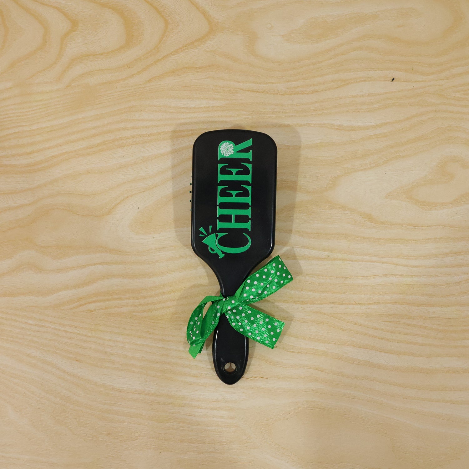 Kids printed hair brush with cute ribbon bow handle by Wukusy, featuring a detangling hair comb for gentle styling.