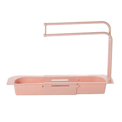 Wukusy kitchen sink organizer rack with towel holder and drain tray, featuring multiple compartments for dishware and utensils.