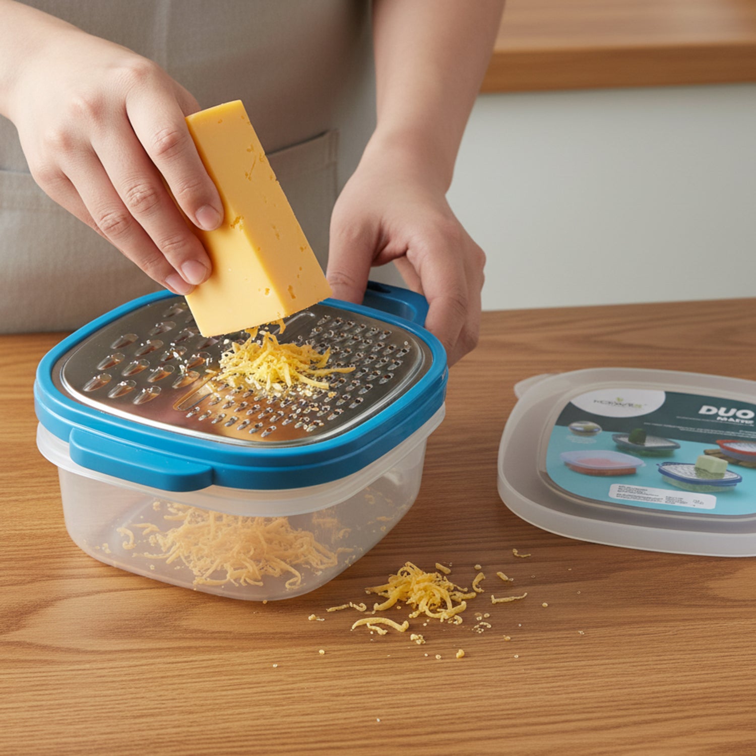 Wukusy Konvex Duo Grater with container and lid, stainless steel kitchen tool for grating and storing food.