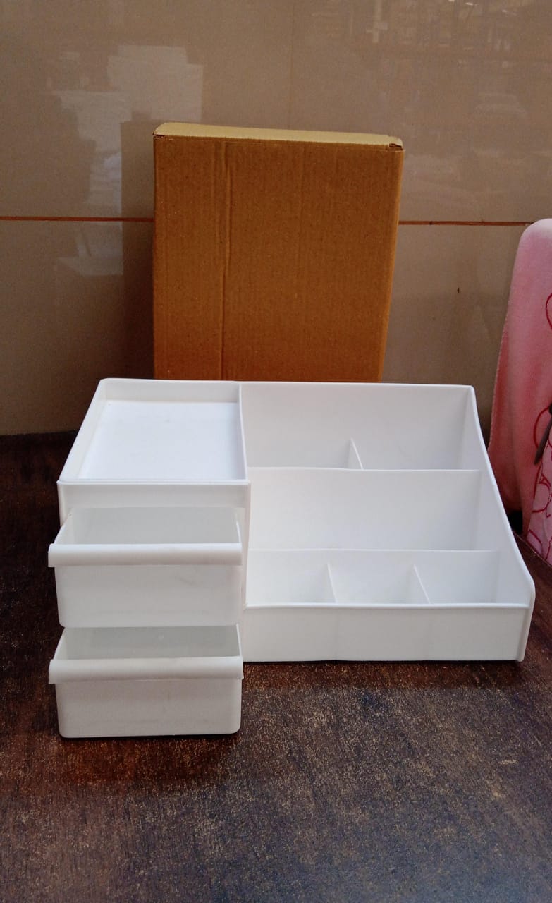 Wukusy large capacity desktop cosmetic storage box in mixed colors, with multiple compartments for organizing beauty products.