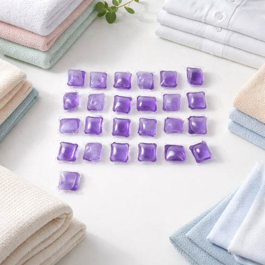 Wukusy laundry detergent pods in a 25-piece pack, showing clear pods with blue and white cleaning solution inside.