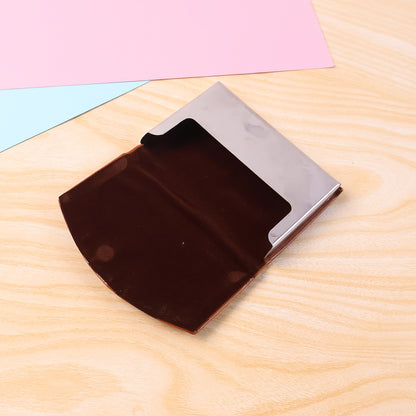 Wukusy leather and stainless steel business card holder with secure snap closure on a white background