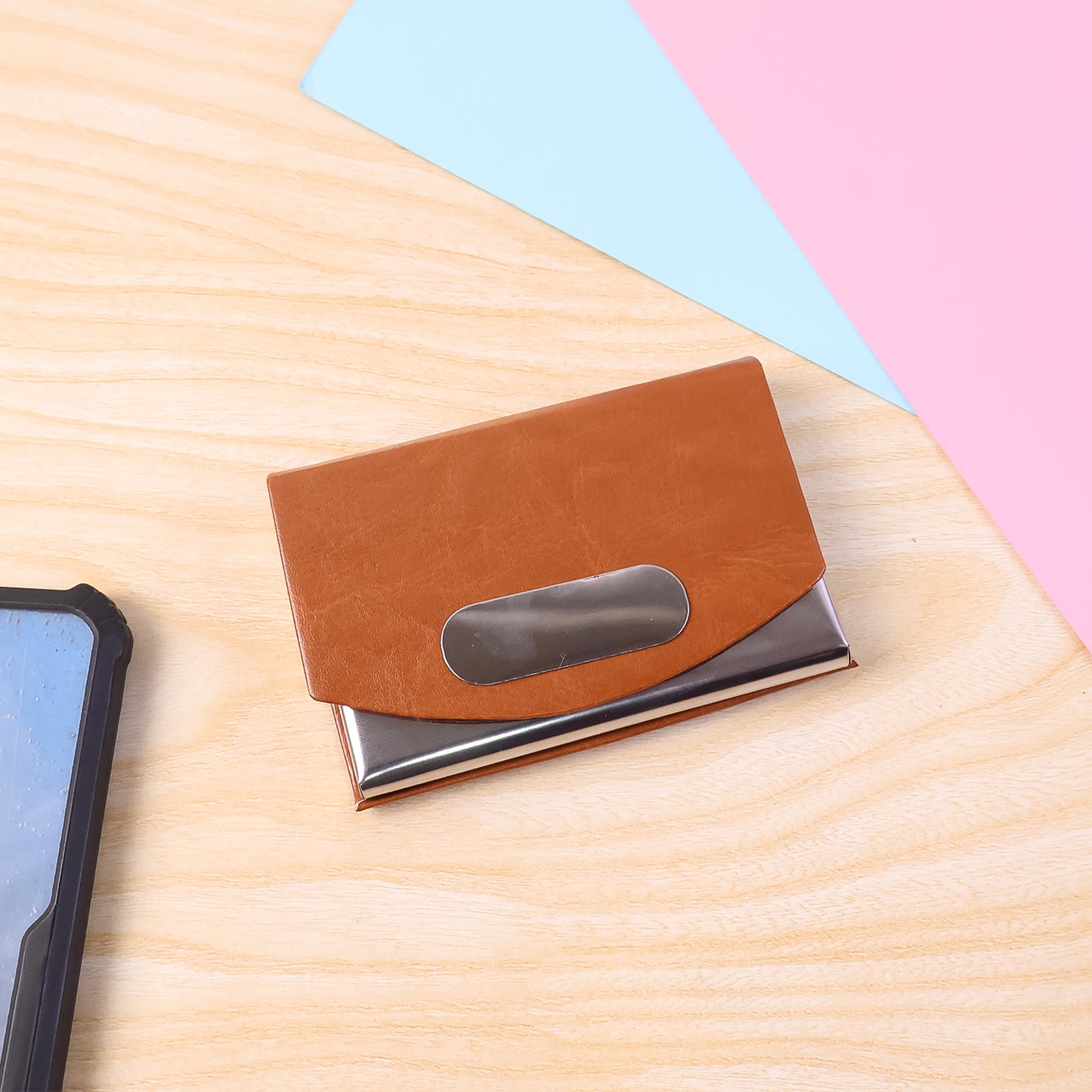 Leather and stainless steel business card holder by Wukusy, compact design with sleek finish for professional card organization.