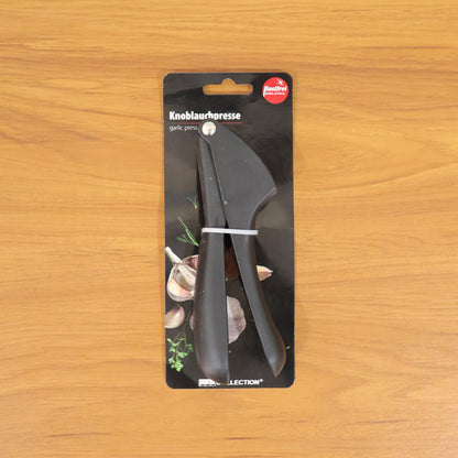Wukusy manual garlic press crusher tool, 1-piece, stainless steel kitchen gadget for easy garlic mincing and crushing.