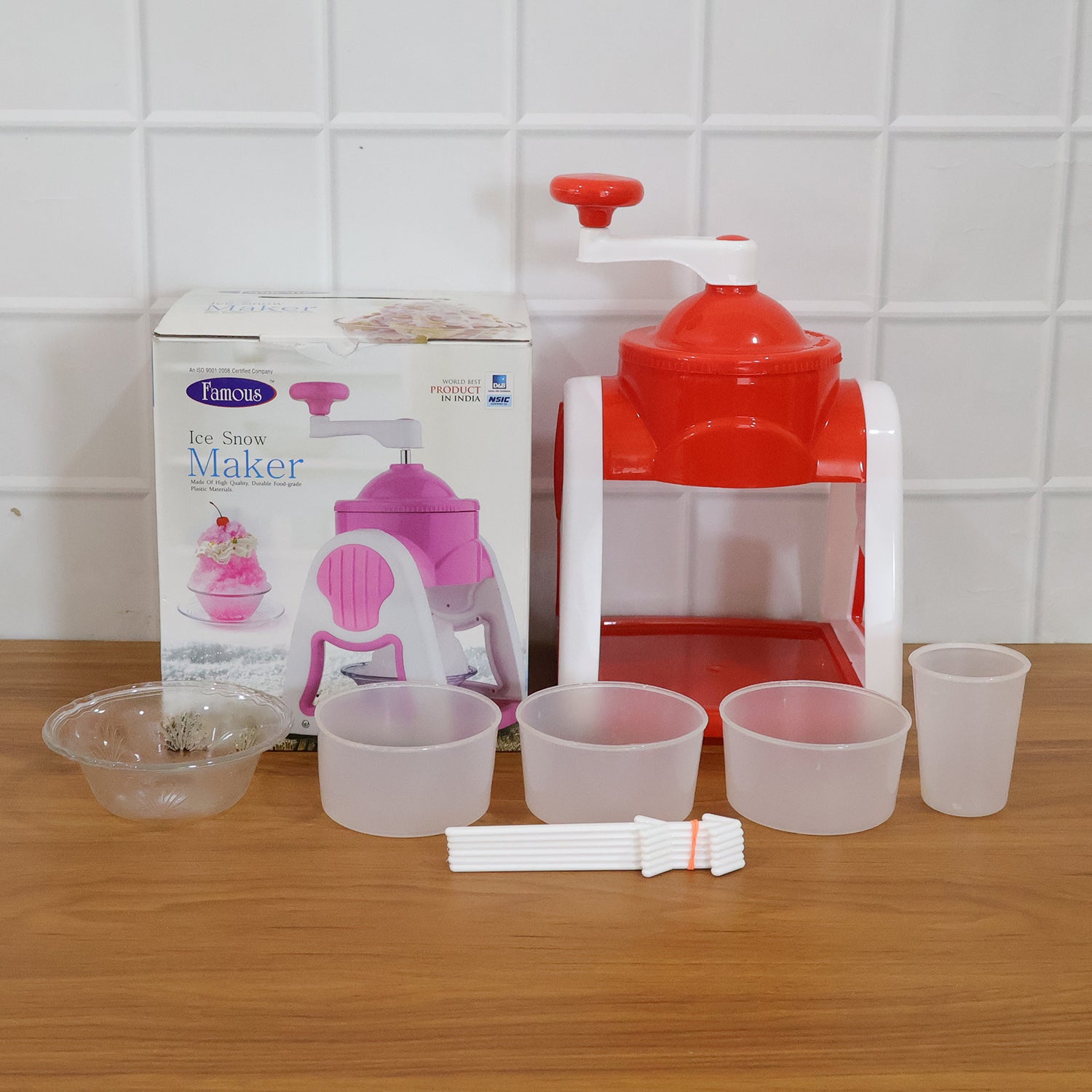 Red Wukusy manual ice snow maker machine set with handle and chute for easy snow creation.