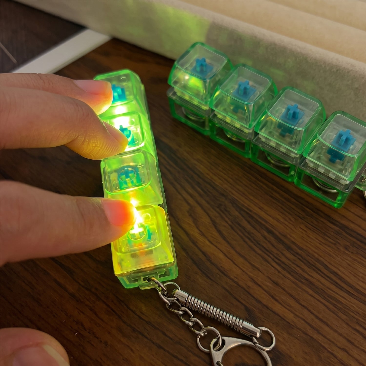 Wukusy mechanical keyboard switch keychain featuring a replica switch for keyboard enthusiasts, compact and detailed keychain accessory.