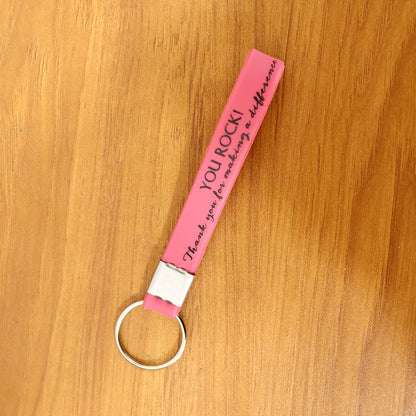 Wukusy motivational silicone wrist strap keychain in mixed colors, featuring inspirational design and durable silicone material.