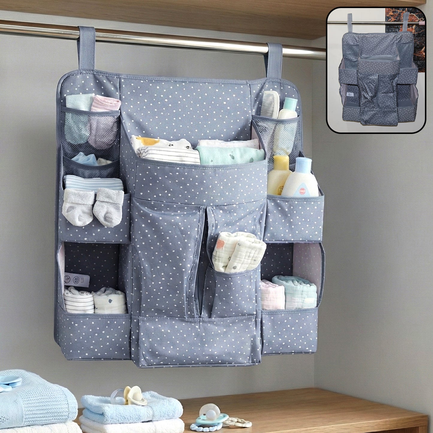 Wukusy multi-pocket hanging baby care organizer with multiple compartments for baby essentials, hanging on a nursery wall.