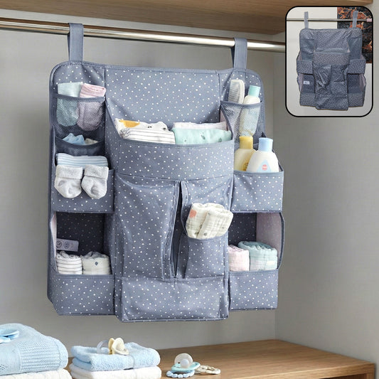 Wukusy multi-pocket hanging baby care organizer with multiple compartments for baby essentials, hanging on a nursery wall.