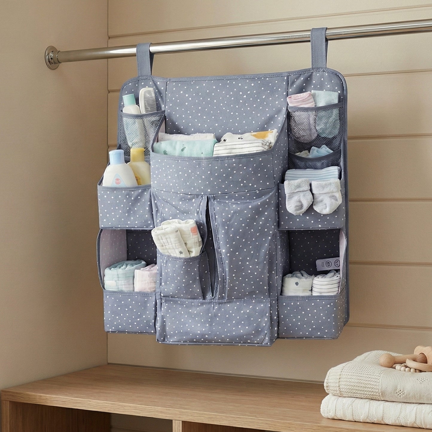 Wukusy multi-pocket hanging baby care organizer with multiple compartments for diapers, wipes, and baby essentials.