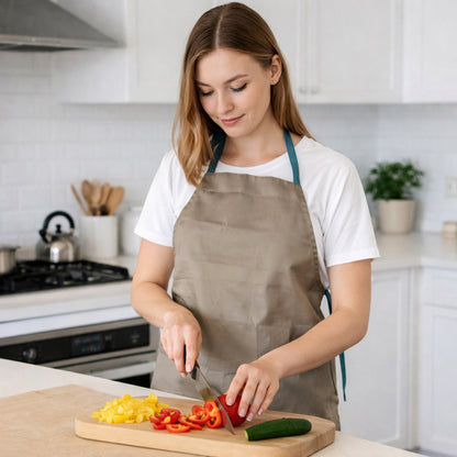 Wukusy multipurpose kitchen cooking apron, 1-piece, with adjustable straps and front pockets for cooking and baking tasks.