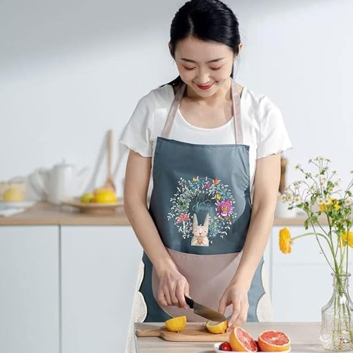 Wukusy multipurpose kitchen cooking apron with front pocket, made of durable fabric, ideal for cooking, baking, and grilling.