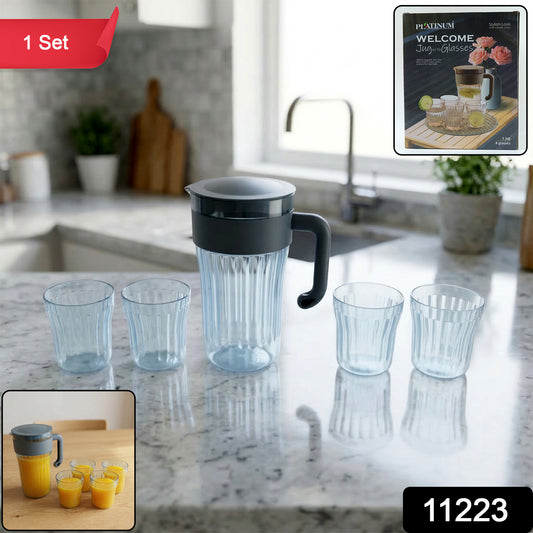 Wukusy multipurpose plastic water and juice serving jug with four matching drinking glasses set on a table.