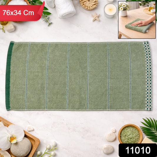Soft cotton bath towel by Wukusy, 76x34 cm, versatile and plush for drying and relaxing after bath or shower.