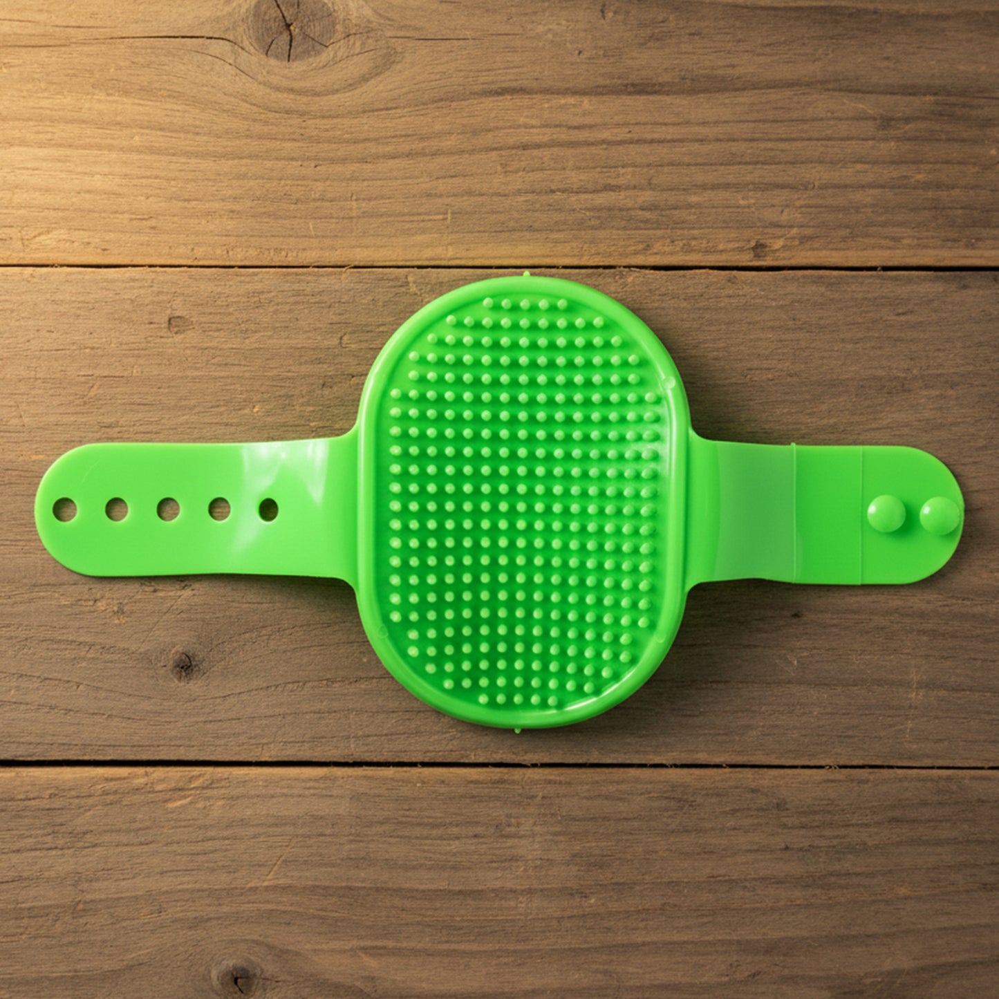 Wukusy pet grooming bath brush with adjustable hand strap for dogs and cats, showing the brush's ergonomic design and bristles.