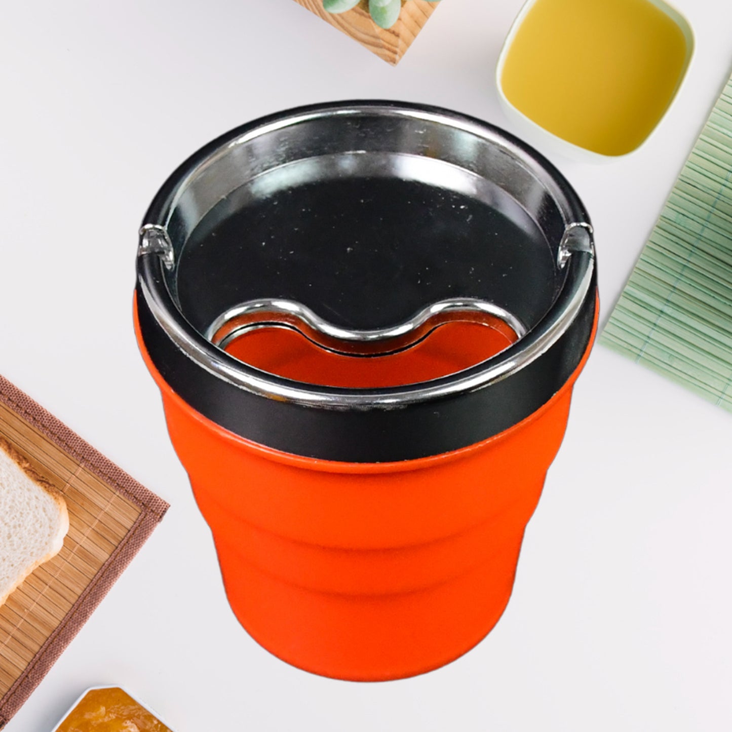 Wukusy plastic car ashtray holder cup with lid, compact and portable for vehicle interior use, shown with lid closed.