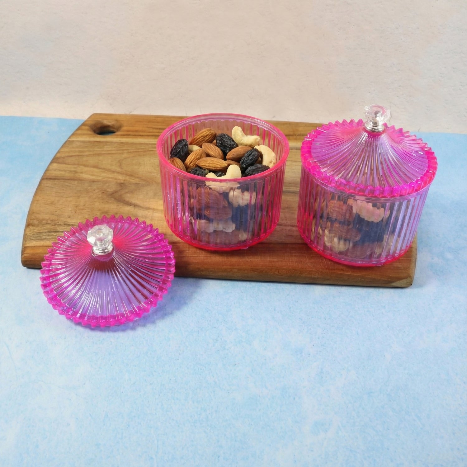 Two transparent plastic dry fruit storage jars by Wukusy, luxury design with secure lids for fresh dry fruits.