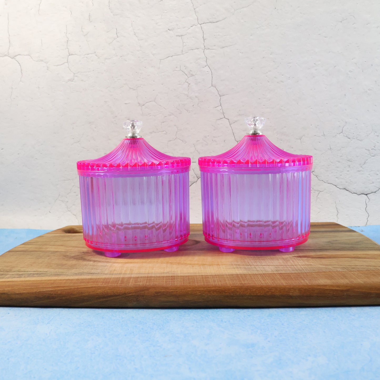 Two transparent plastic luxury dry fruit storage jars by Wukusy, showcasing clear lids and spacious design for kitchen organization.