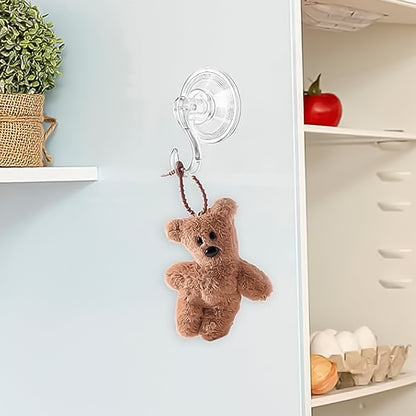Set of four Wukusy plastic suction cup hooks attached to a bathroom wall for hanging towels and accessories.