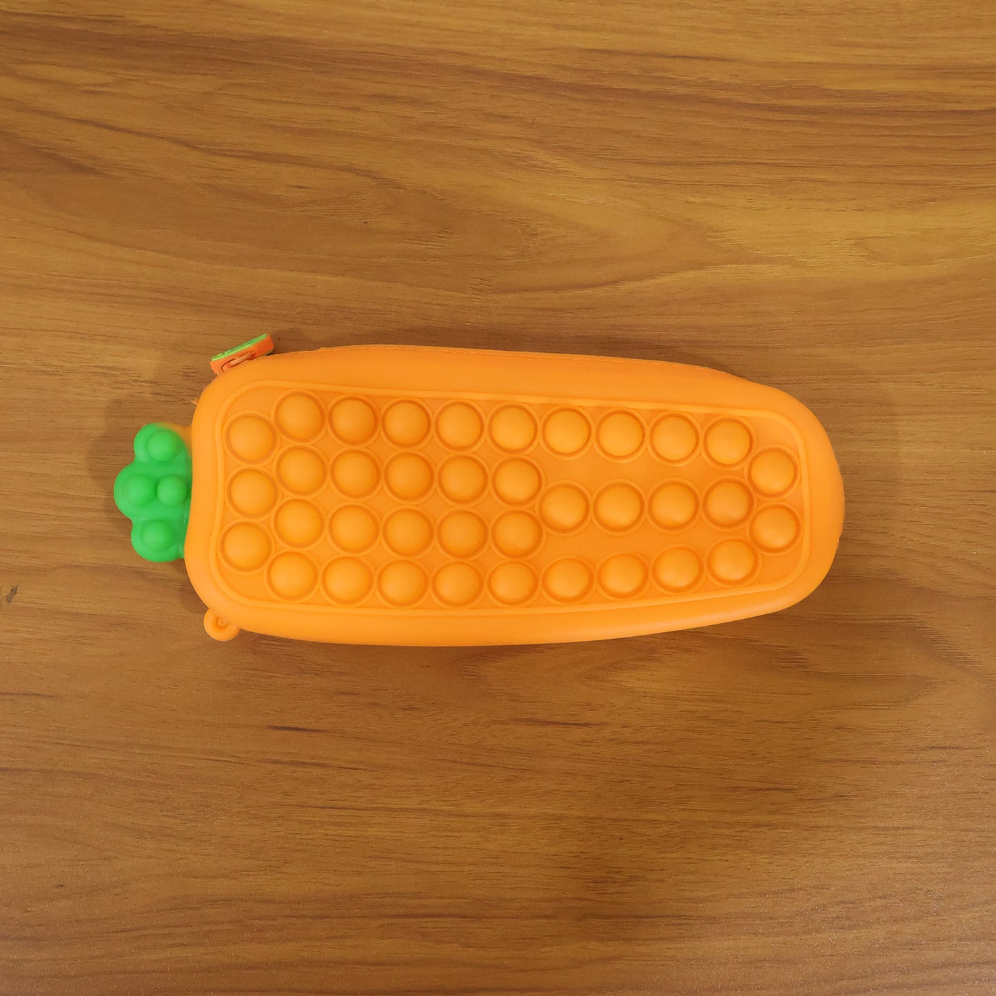 Wukusy Pop It pencil pouch with zipper, colorful silicone design for storing pencils and stationery, portable and fun.