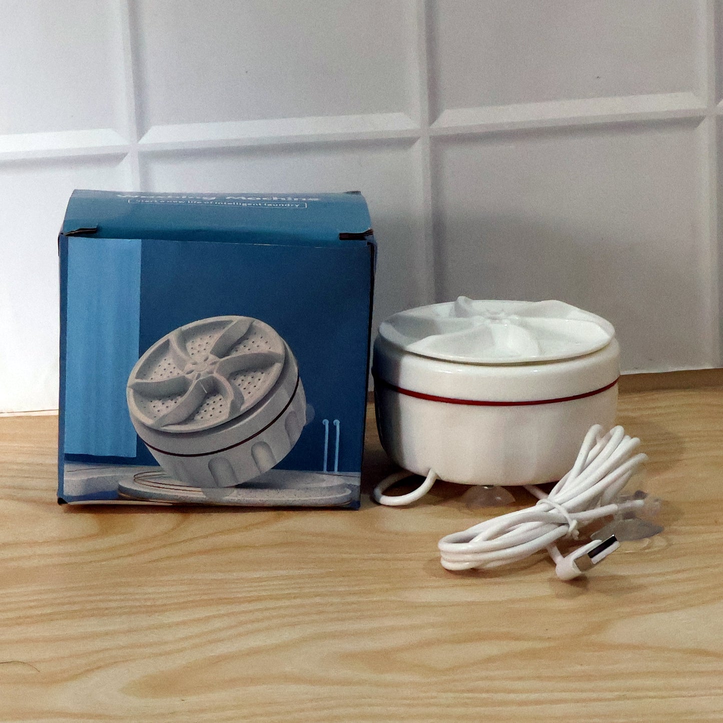 Wukusy portable mini electric washing machine, compact appliance with control panel, ideal for small laundry loads.