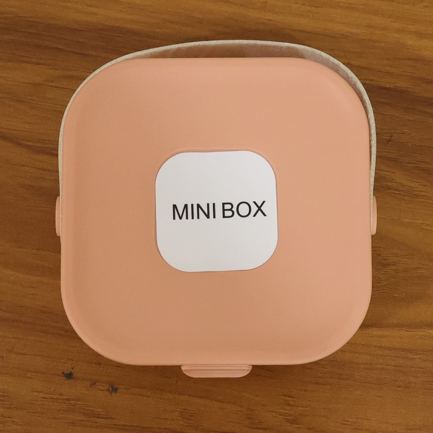 Wukusy portable mini jewelry storage box with compartments for rings, earrings, and necklaces, compact and lightweight.