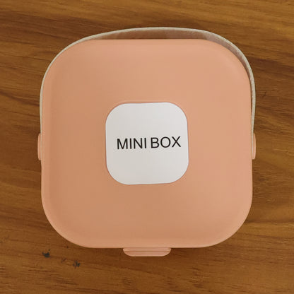 Wukusy portable mini jewelry storage box with compartments for rings, earrings, and necklaces, compact and lightweight.