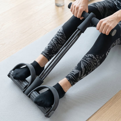 Wukusy portable pull rope resistance exerciser with foot pedal support, compact workout equipment for strength training.
