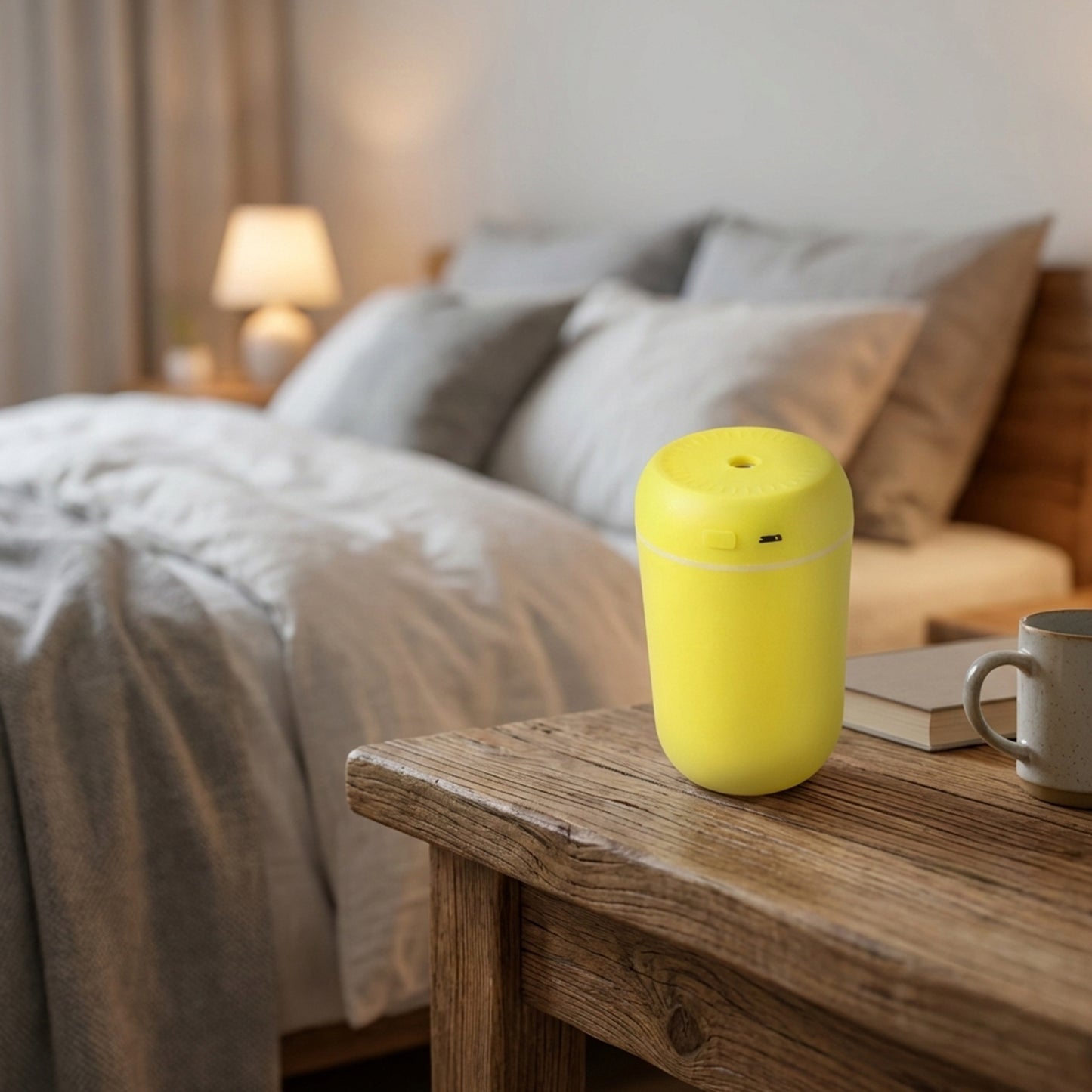Wukusy portable USB-powered mini air humidifier emitting a fine mist, compact design ideal for desktop use.