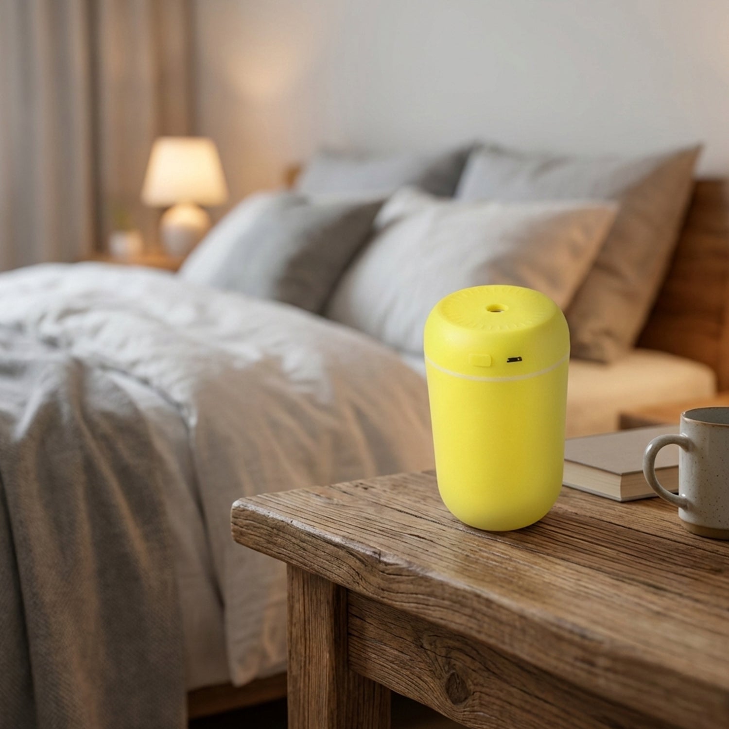 Wukusy portable USB-powered mini air humidifier emitting a fine mist, compact design ideal for desktop use.
