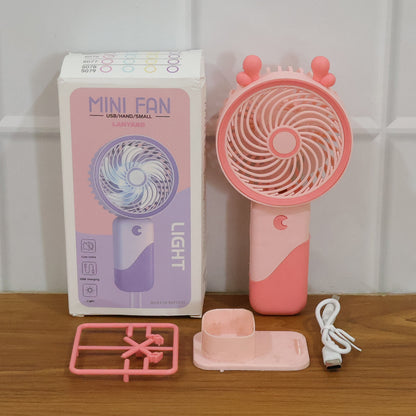 Wukusy portable USB rechargeable mini fan with LED light, compact handheld design for personal cooling.