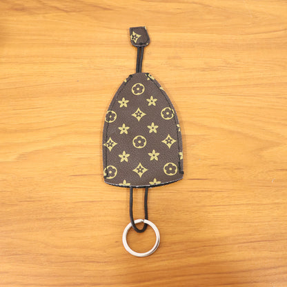 Wukusy premium designer-style keyholder and key case, black leather with metal key rings and secure closure.