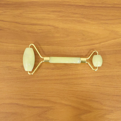 Wukusy premium dual-head jade stone face roller and Gua Sha massage tool set on a white background.