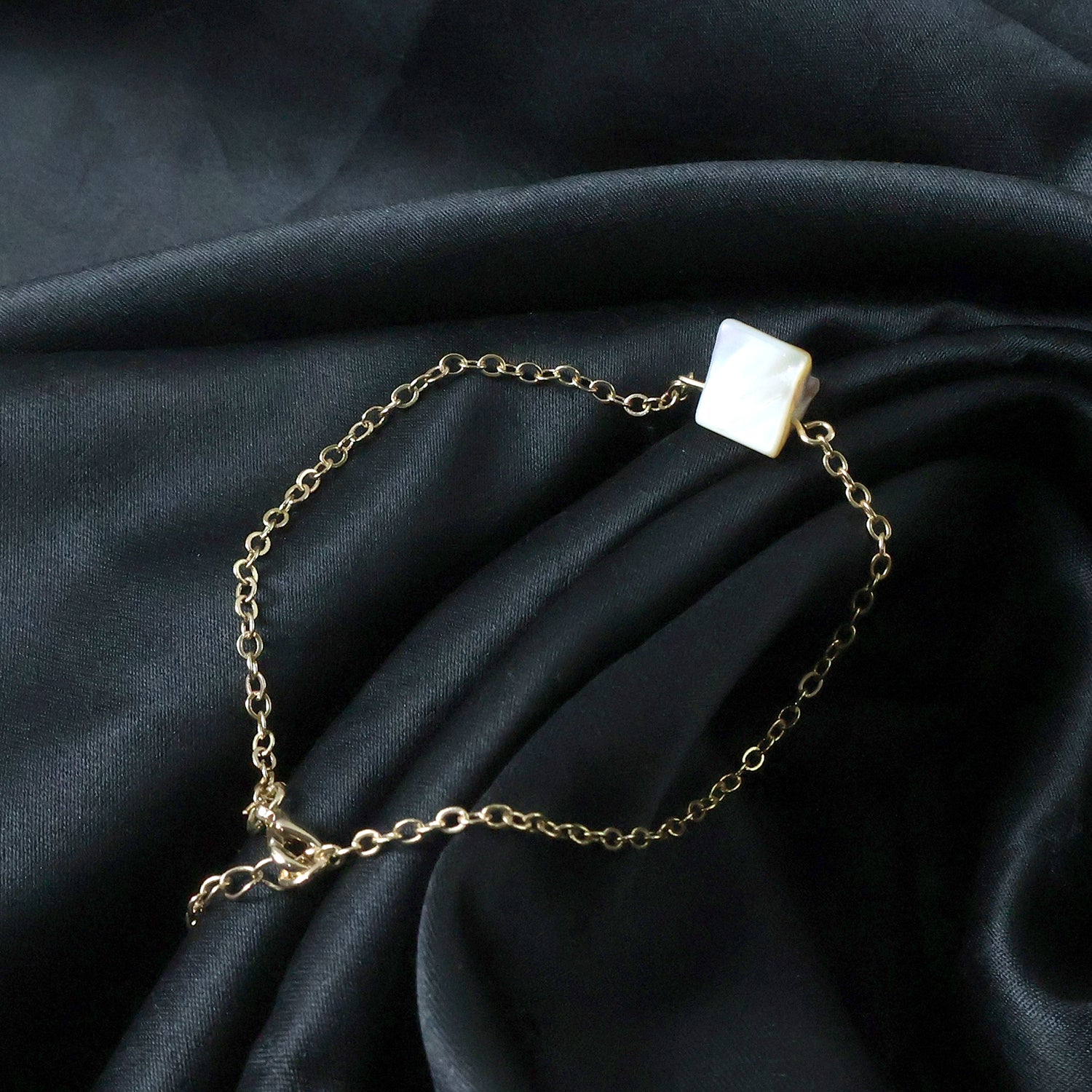 Elegant adjustable chain bracelet by Wukusy featuring a mix of stylish designs on a sleek metal chain.