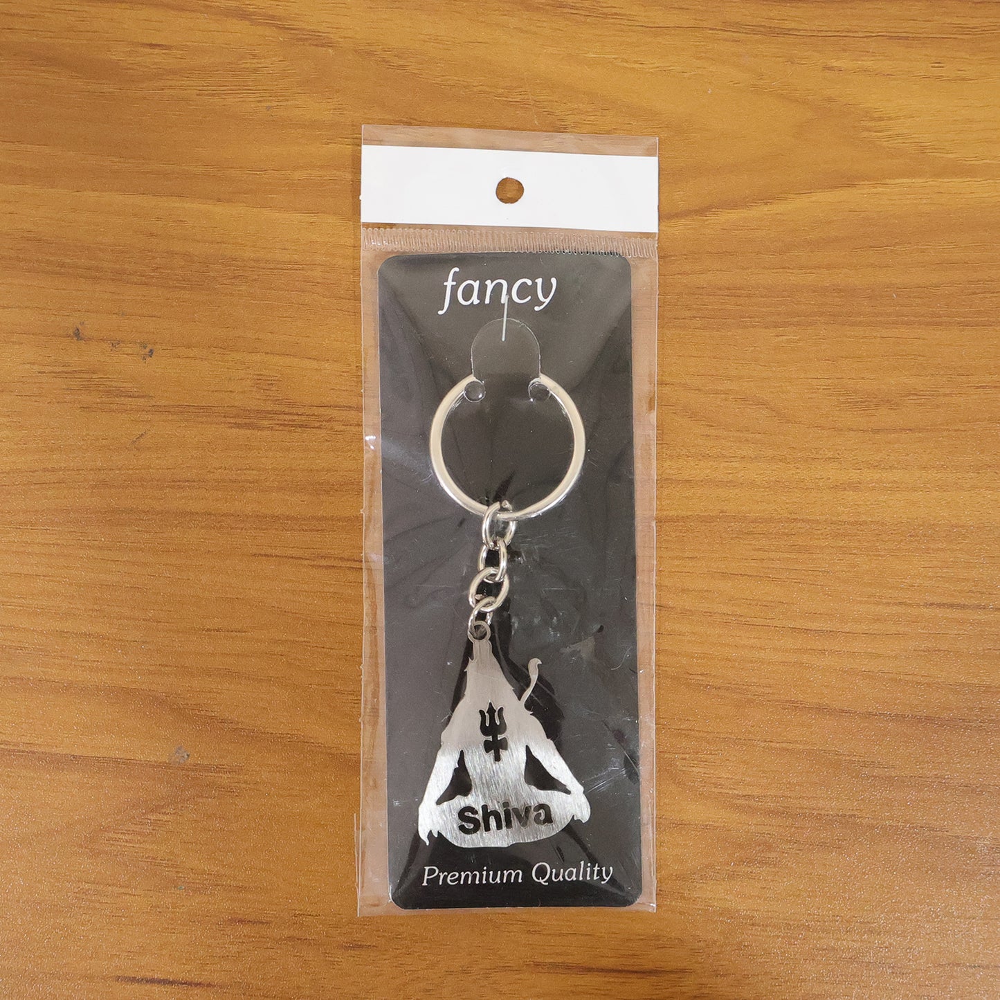 Metal Lord Shiva Trishul design keychain from Wukusy, featuring intricate metal craftsmanship and religious symbolism.