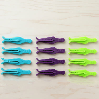 Set of 12 Wukusy premium plastic laundry cloth drying clips, strong and durable cloth pins for hanging clothes.